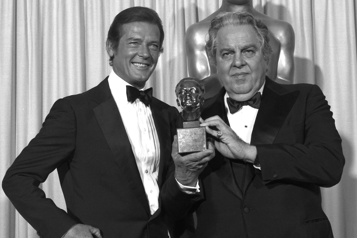 Robert Moore and Albert R. “Cubby” Broccoli stand together at the Oscars